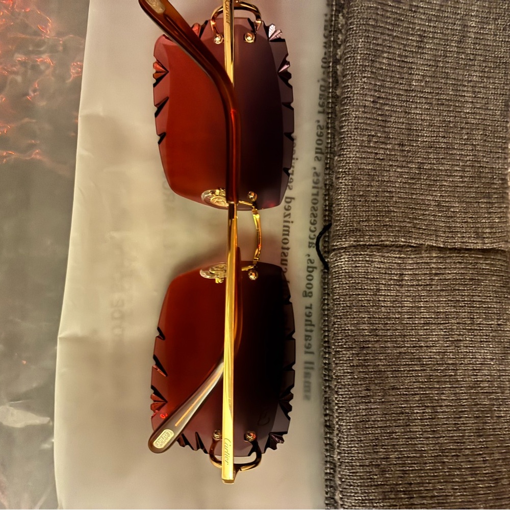 Gold and red cartier glasses